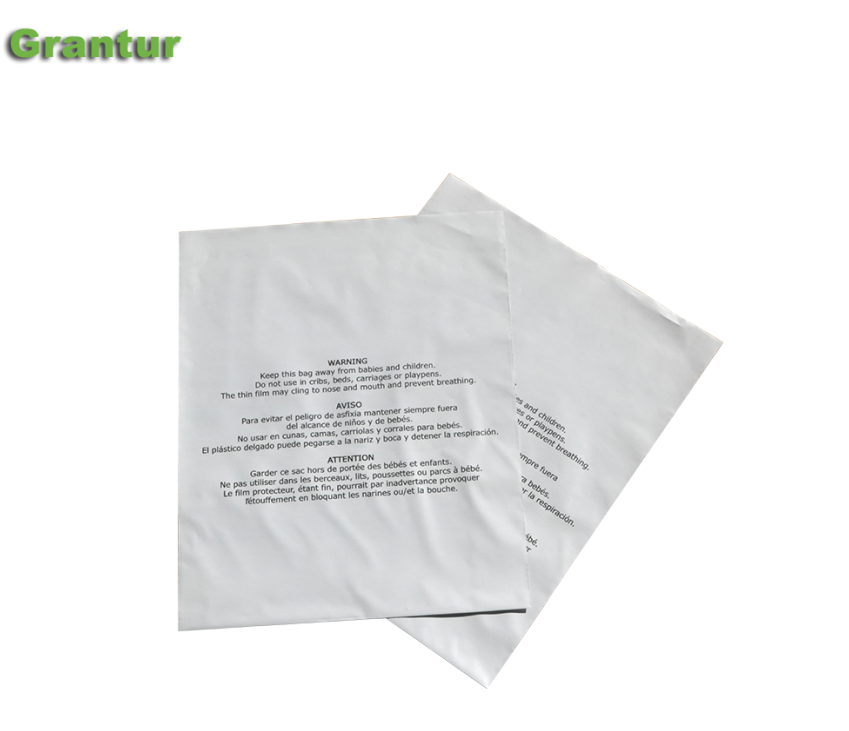 white opaque poly bags with suffocation warning printed